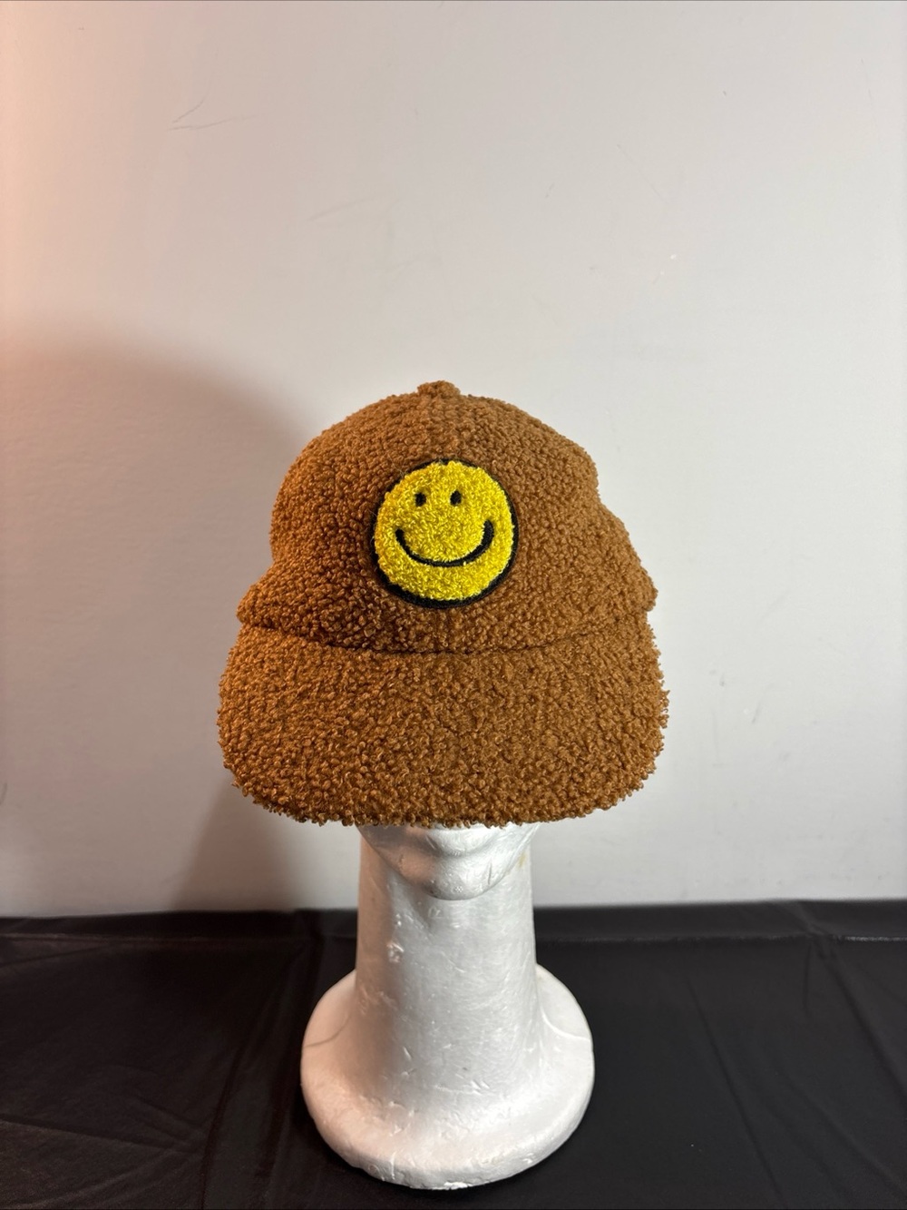 Kids Brown Sherpa Cap with Yellow Smiley Patch. 9/10